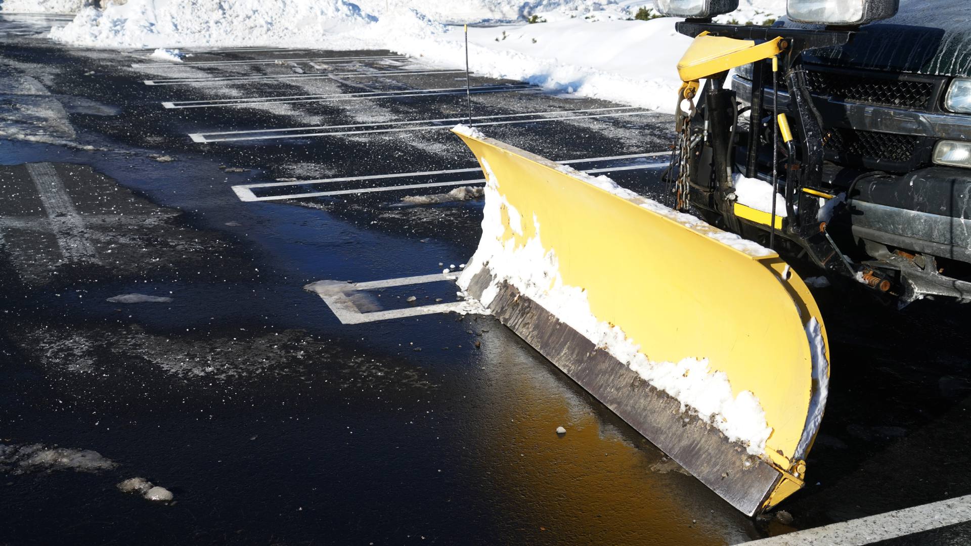 Commercial snow plow truck in parking lot in North Mankato, MN.