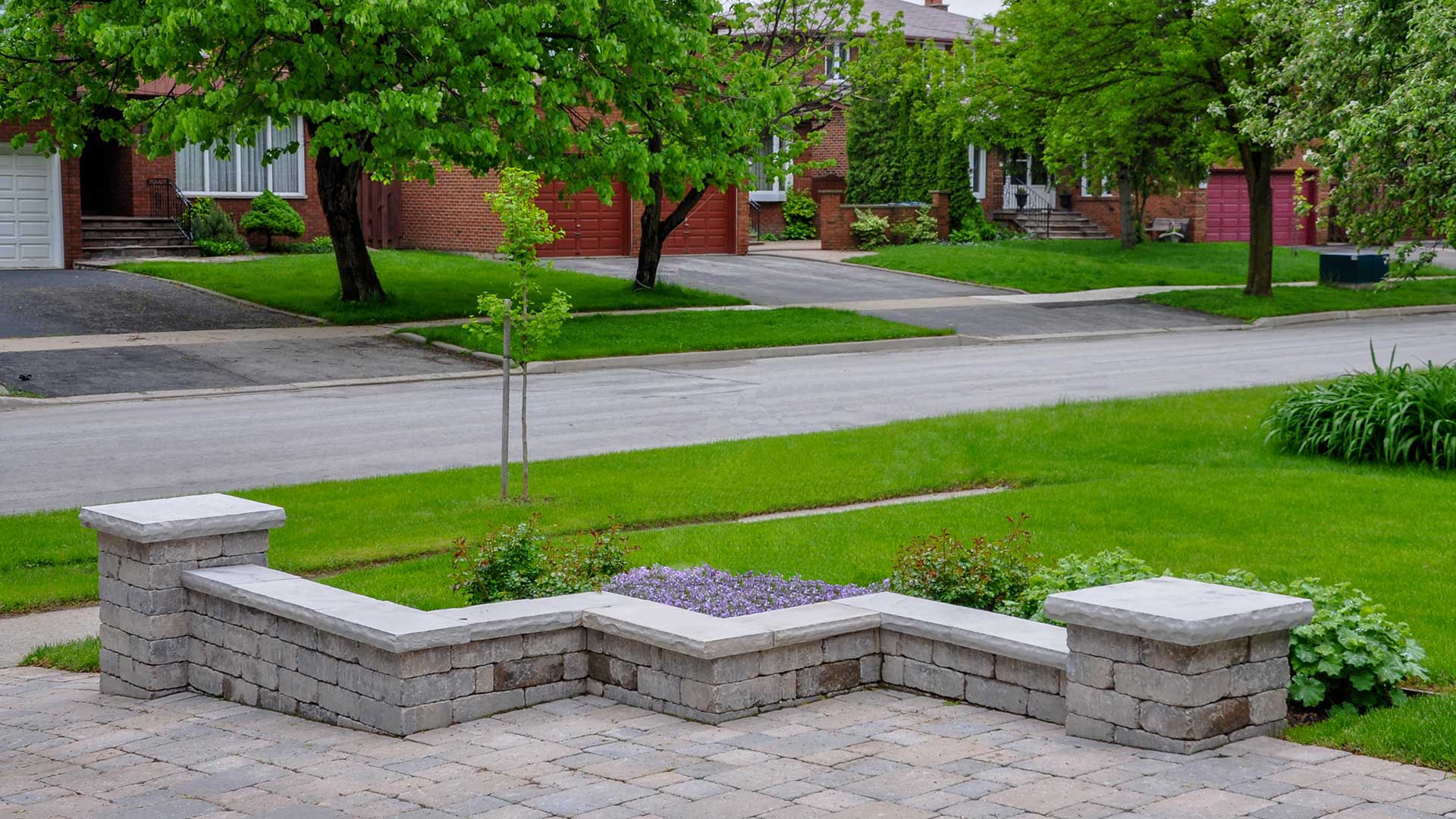Seating wall and walkway built out of concrete pavers in North Mankato, MN.
