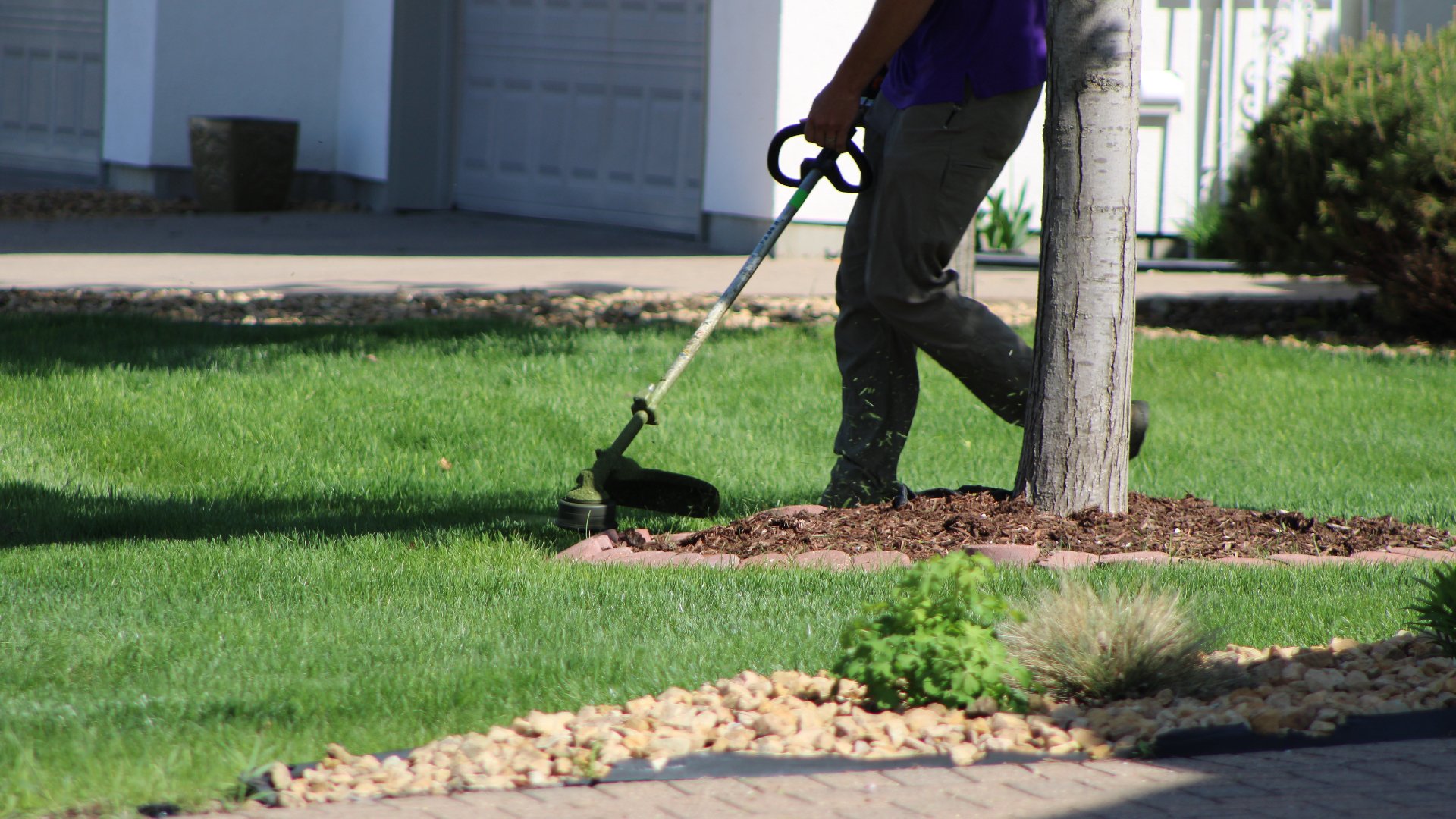 Our landscape professional edging a landscape bed for our client in Cleveland, MN.
