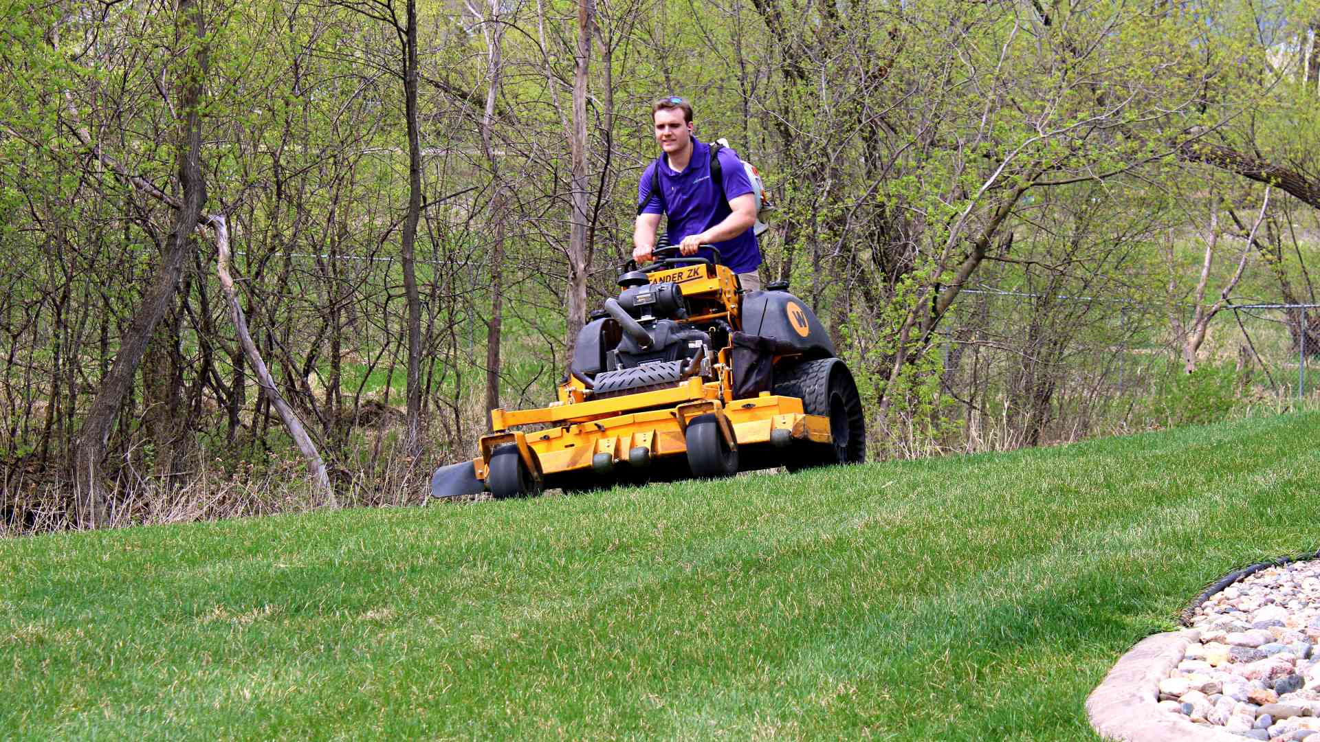 Mower in commercial lawn in Mankato, MN.