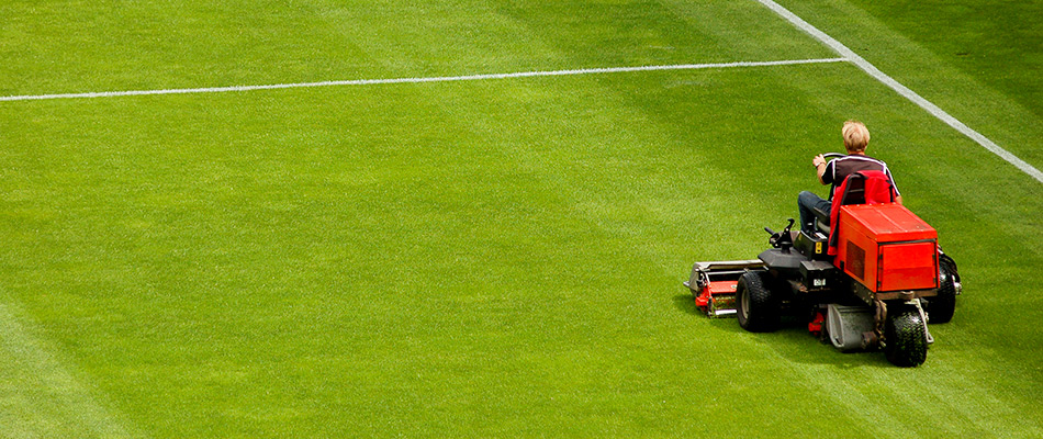 A pristine sports field being mowed by professionals in Eagle Lake, MN.