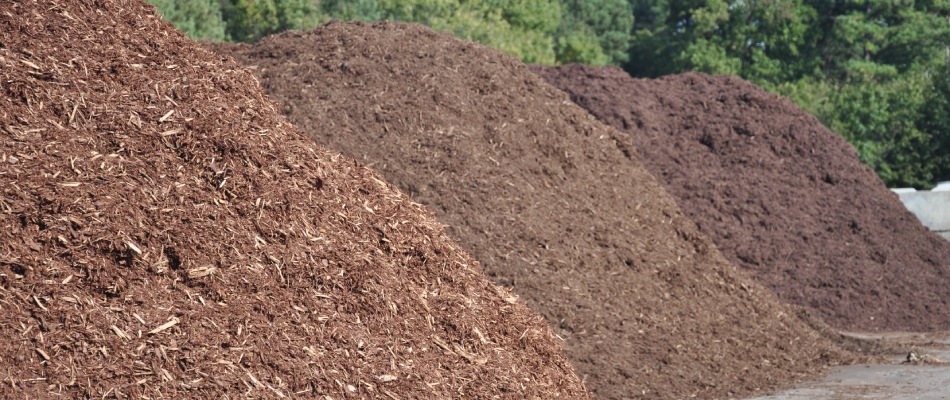 Variety of different colored mulch mounds in North Mankato, MN.